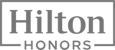 The image shows the logo for Hilton Honors, a loyalty program offered by Hilton Hotels & Resorts.